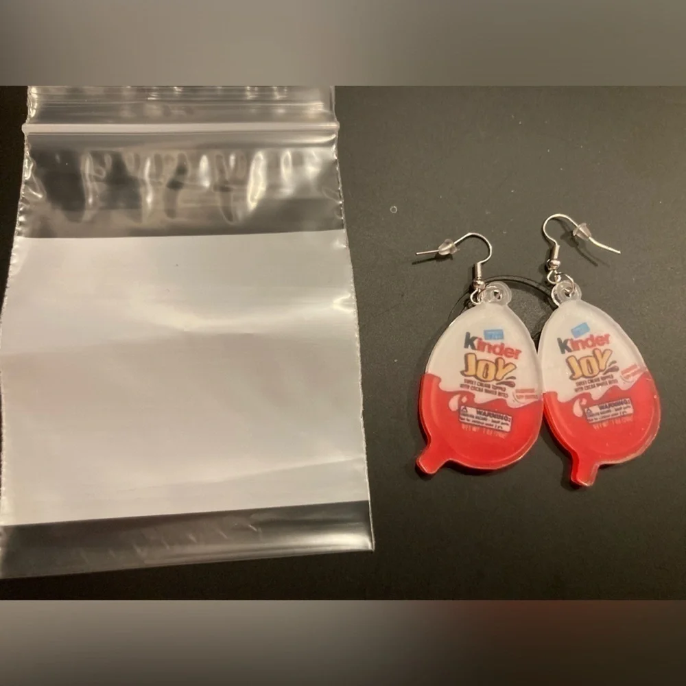 4/$25 Kinder Joy dangle earrings. NWOT. Adorable & perfect for the candy fan
